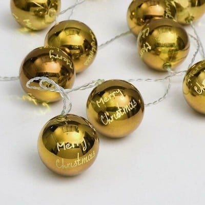 Χρυσαφί μπάλες merry christmas σε διάφανο καλώδιο 135cm με μπαταρίες
